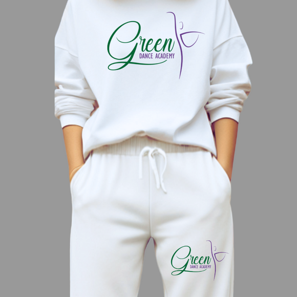White sweatshirt and pants with 'Green Dance Academy' logo worn by a person in a kitchen.