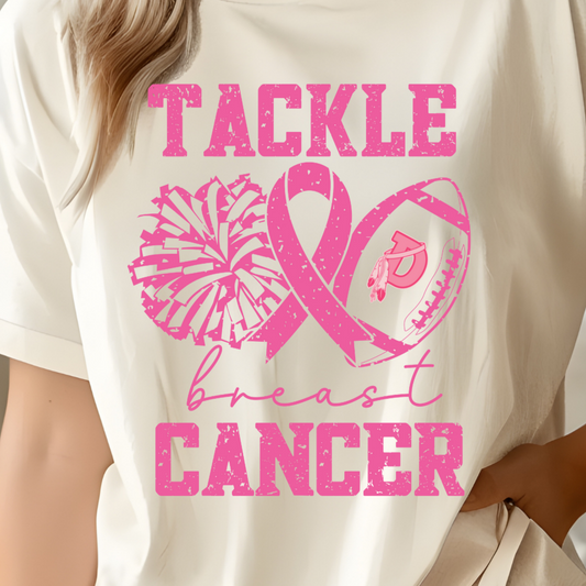 Person wearing a beige t-shirt with pink breast cancer awareness design