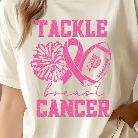 Person wearing a beige t-shirt with pink breast cancer awareness design
