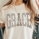 A 3x3 collage showing nine different color and style options of a graphic t-shirt. The shirts feature phrases like 'ain't no ghost like the holy ghost' and 'JESUS Not Coffee' with various graphic designs, shown on models wearing jeans.