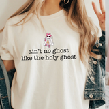 A 3x3 collage showing nine different color and style options of a graphic t-shirt. The shirts feature phrases like 'ain't no ghost like the holy ghost' and 'JESUS Not Coffee' with various graphic designs, shown on models wearing jeans.