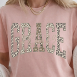 A 3x3 collage showing nine different color and style options of a graphic t-shirt. The shirts feature phrases like 'ain't no ghost like the holy ghost' and 'JESUS Not Coffee' with various graphic designs, shown on models wearing jeans.