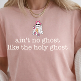 A 3x3 collage showing nine different color and style options of a graphic t-shirt. The shirts feature phrases like 'ain't no ghost like the holy ghost' and 'JESUS Not Coffee' with various graphic designs, shown on models wearing jeans.