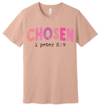 A 3x3 grid showing nine light peach-beige short-sleeve T-shirts, each with a different inspirational Bible verse or quote printed on the front in various colors and styles.