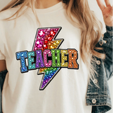 A 3x3 collage showing a woman wearing different colorful teacher-themed graphic t-shirts. The designs include a pink gingham apple, blue floral 'TEACHER' text, a rainbow subtraction quote, cartoon characters, a purple lightning bolt, a pink cross, and other decorative text prints.