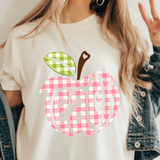 A 3x3 collage showing a woman wearing different colorful teacher-themed graphic t-shirts. The designs include a pink gingham apple, blue floral 'TEACHER' text, a rainbow subtraction quote, cartoon characters, a purple lightning bolt, a pink cross, and other decorative text prints.
