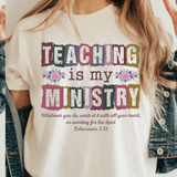 A 3x3 collage showing a woman wearing different colorful teacher-themed graphic t-shirts. The designs include a pink gingham apple, blue floral 'TEACHER' text, a rainbow subtraction quote, cartoon characters, a purple lightning bolt, a pink cross, and other decorative text prints.