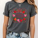 A 3x3 grid showing nine different dark gray graphic t-shirts modeled on a person. The shirts feature various colorful and white inspirational Christian-themed designs including 'HAPPY TO SEE YOUR FACE', 'TEACHER YOU ARE', 'AMEN TEACHERS', and 'JESUS'.