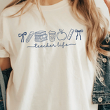 A 3x3 collage showing a woman wearing different colorful graphic T-shirts. Each shirt features a unique teacher-themed design, including quotes like 'HAPPY TO SEE YOUR FACE', 'Teaching is my joy', and 'TEACHER' with a bow, all paired with denim jackets.