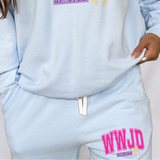 Light blue sweatshirt and pants with 'WWJD' text on a plain background