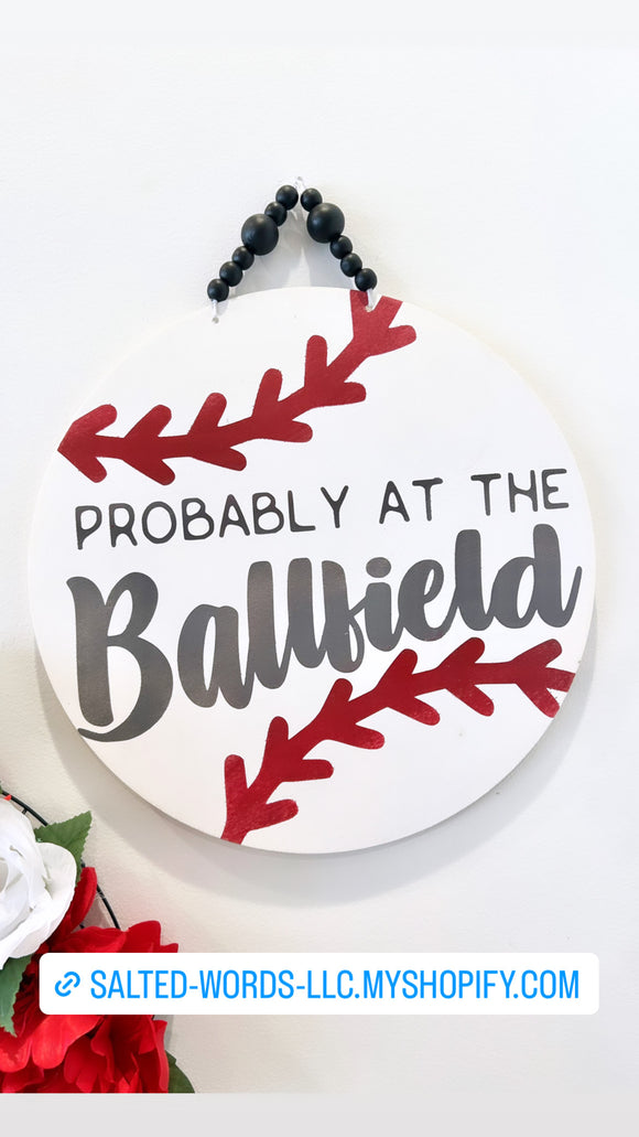 Probably at the ball field 14” baseball door hanger - Salted Words, LLC